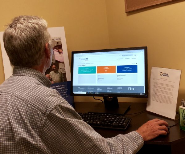 Wes Todd searches for grants for MCH, Inc. at UMC's office.