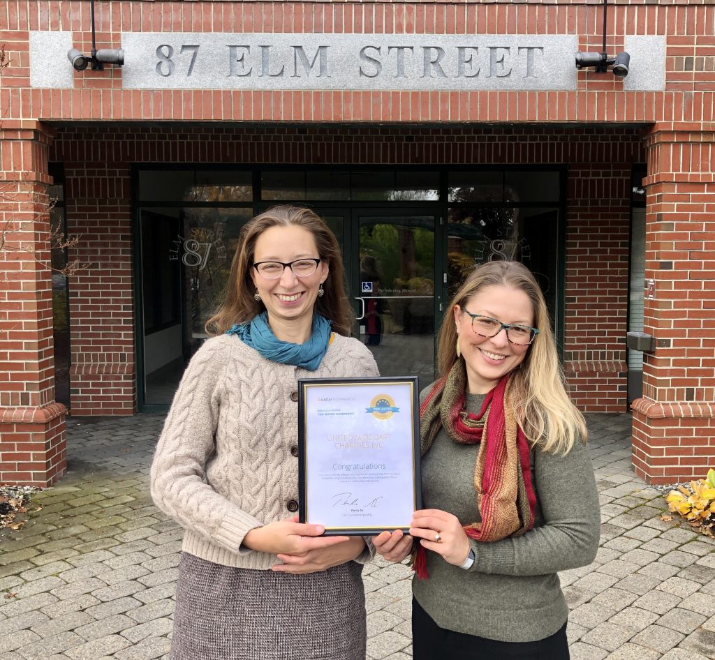 UMC staff Megan Williams and Kelly Carey display the 2019 Top-Rated Award.