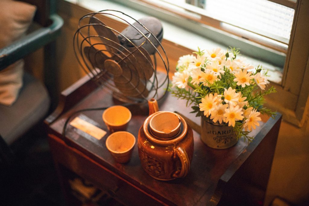 fan on table with teapot