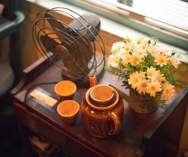 fan on table with teapot