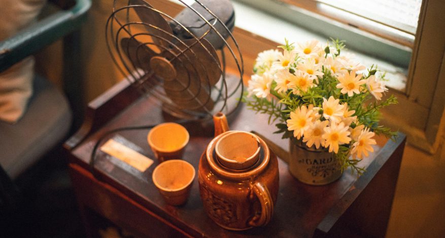 fan on table with teapot